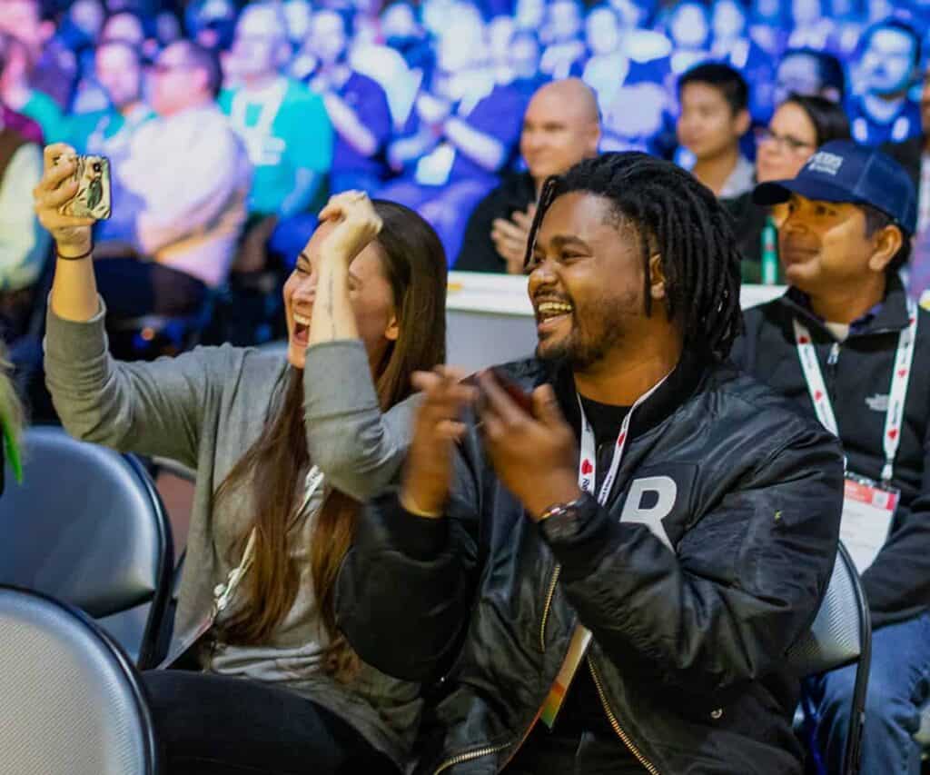 People cheering at a conference