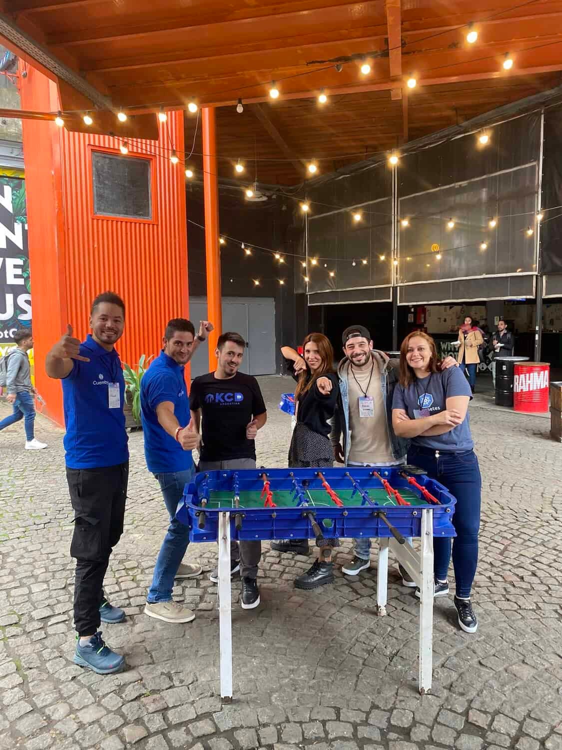 Participants of KCD Argentina posing in front of foosball table
