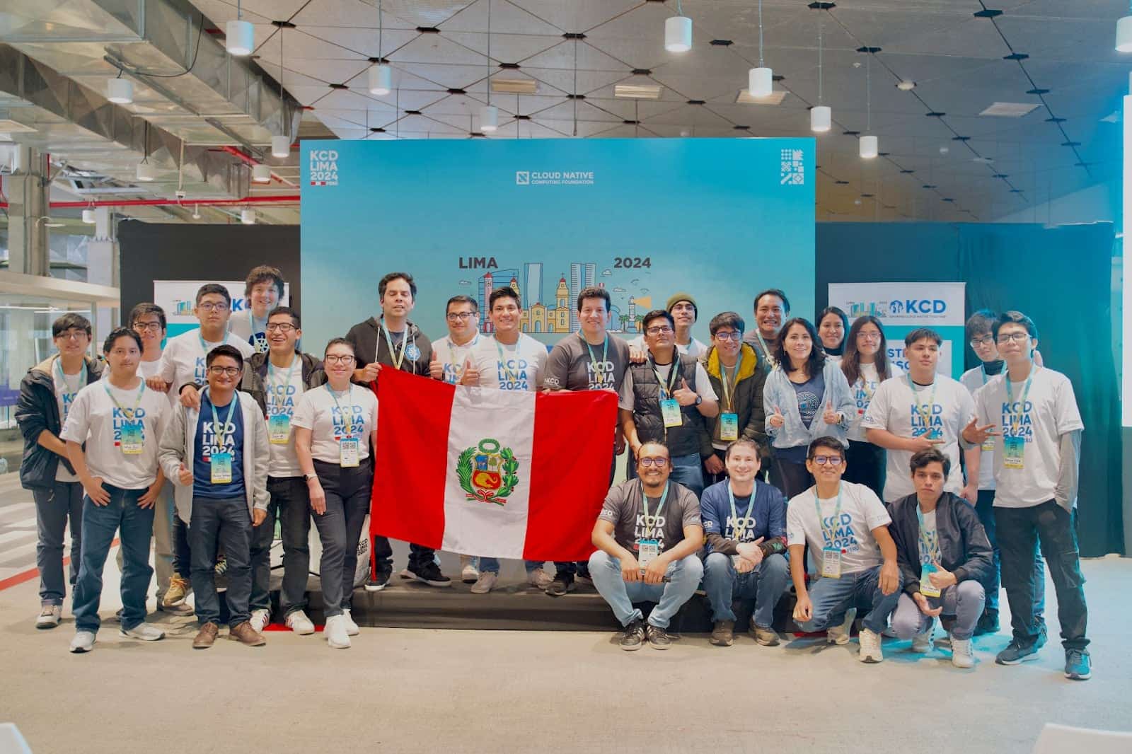 KCD Lima Peru volunteer group holding Peru flag