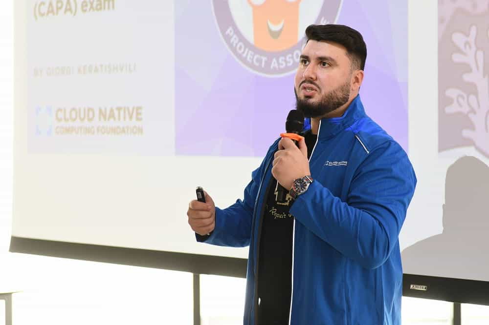 Giorgi Keratishvili talking in front of the screen